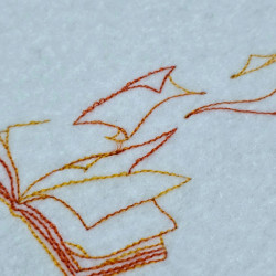 Open Book With Flying Pages