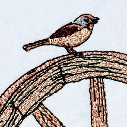 Bird On Wagon Wheel