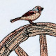 Bird On Wagon Wheel