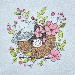 Bird Resting On Floral Nest