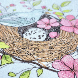 Bird Resting On Floral Nest