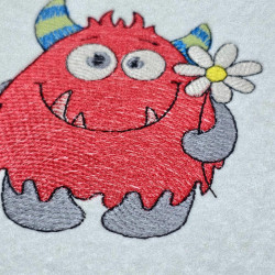 Cute LIttle Monster Holding A Daisey