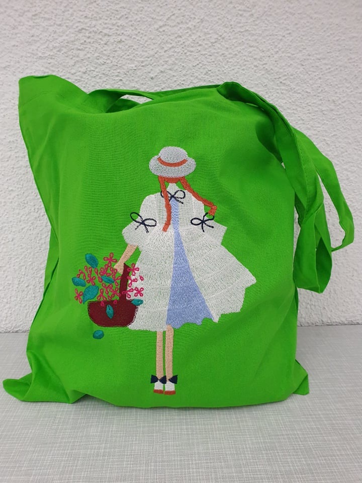 Girl Holding A Flower Basket